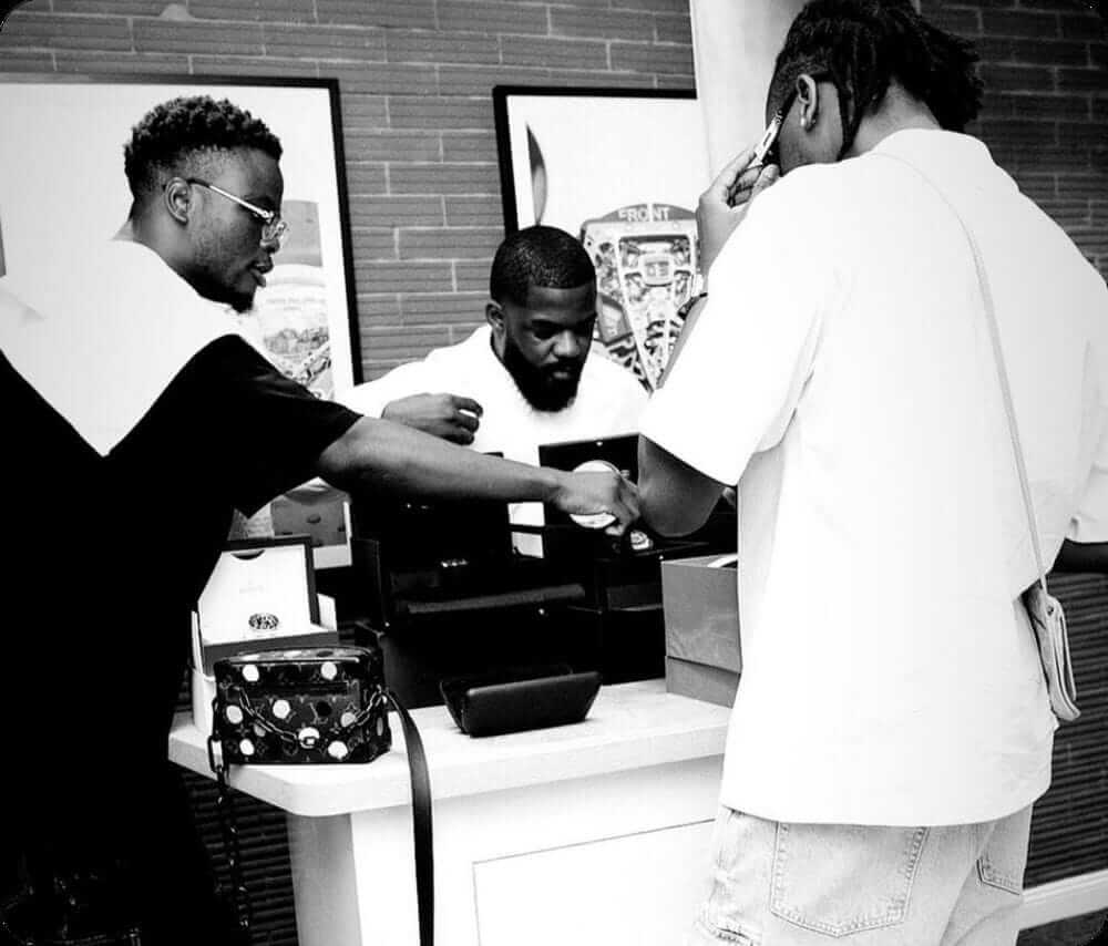 The founder of pawnshop Nigeria making sales to other customers